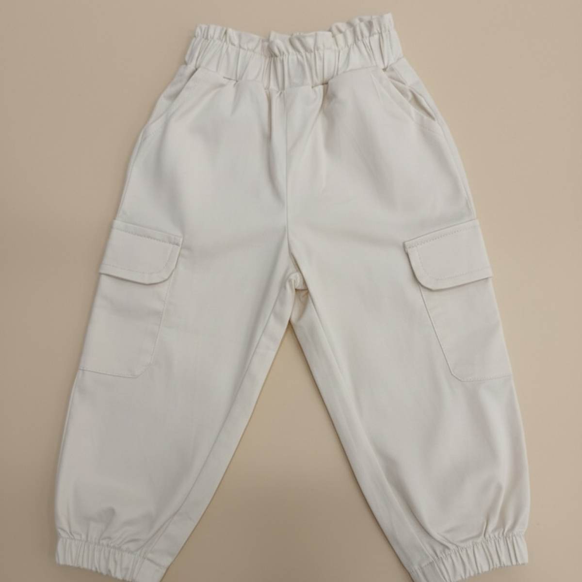 Ver Pantalón cargo bebé unisex beige/camel